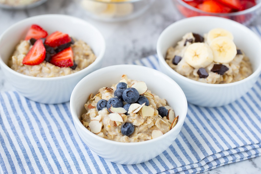 Fresh Fruit And Oatmeal With Healthy Toppings For Breakfast Stock Photo ...