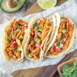 crockpot chicken tacos with avocado and tomatoes